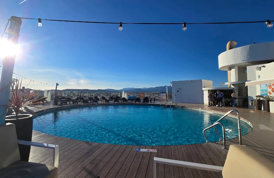 Rooftop pool catching golden sunset light at Sky Bar, Hotel El Puerto Fuengirola