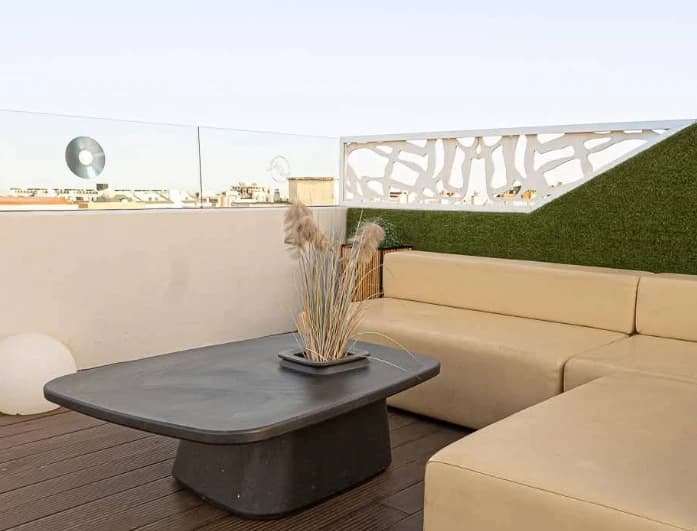 Cream lounge sofa and low table on the terrace at Sky Bar Veramar, Fuengirola