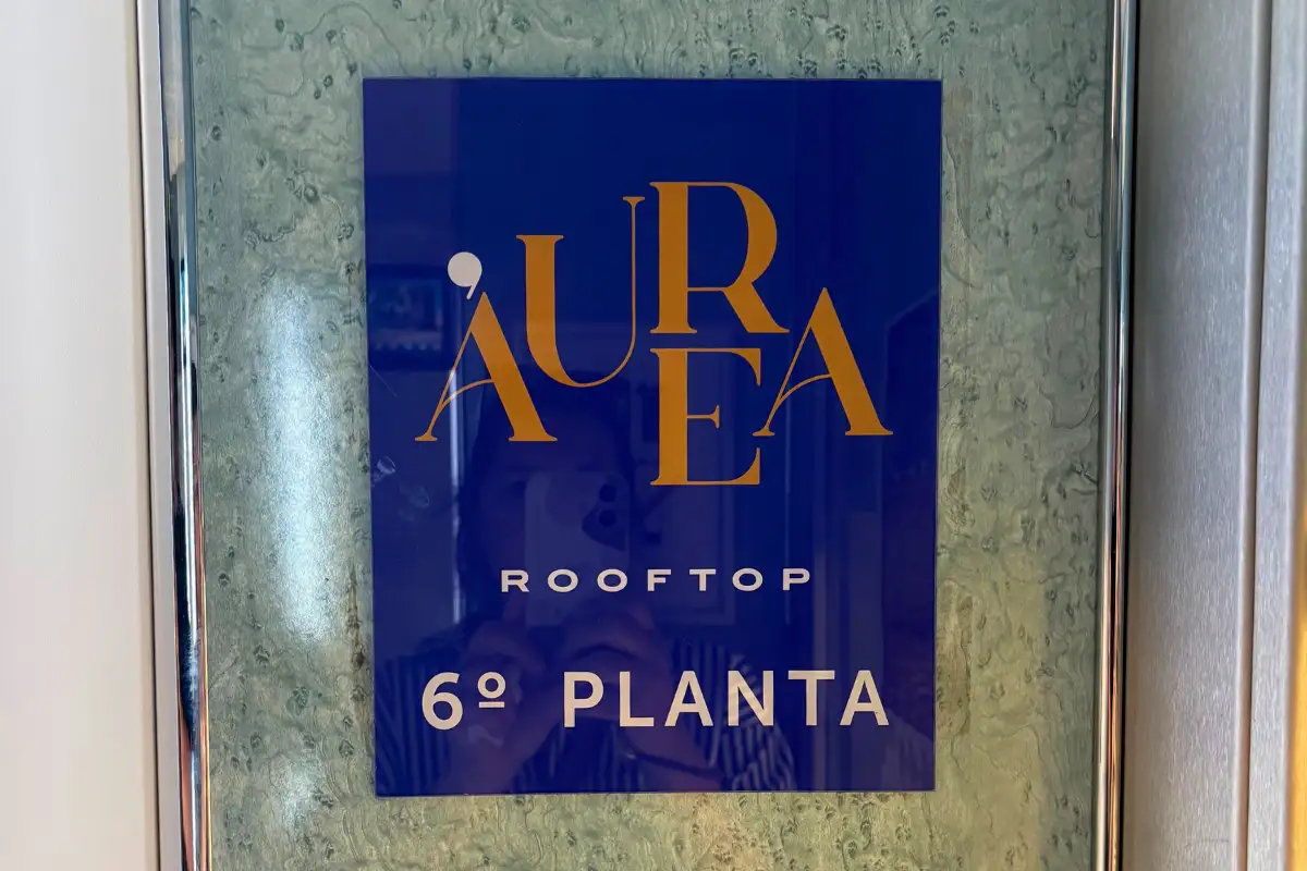 Blue Aurea rooftop sign marking the sixth floor at the Malaga hotel