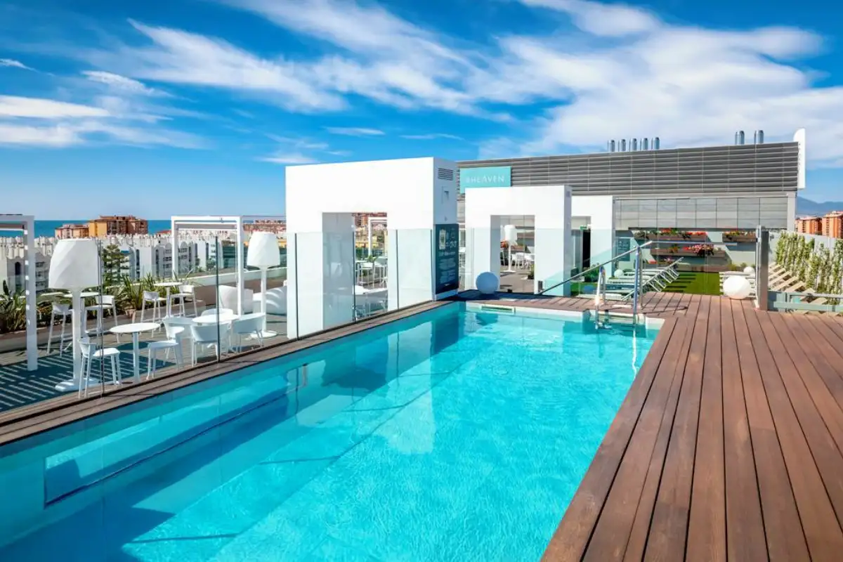 Rooftop infinity pool and sun loungers at B-Heaven in Malaga