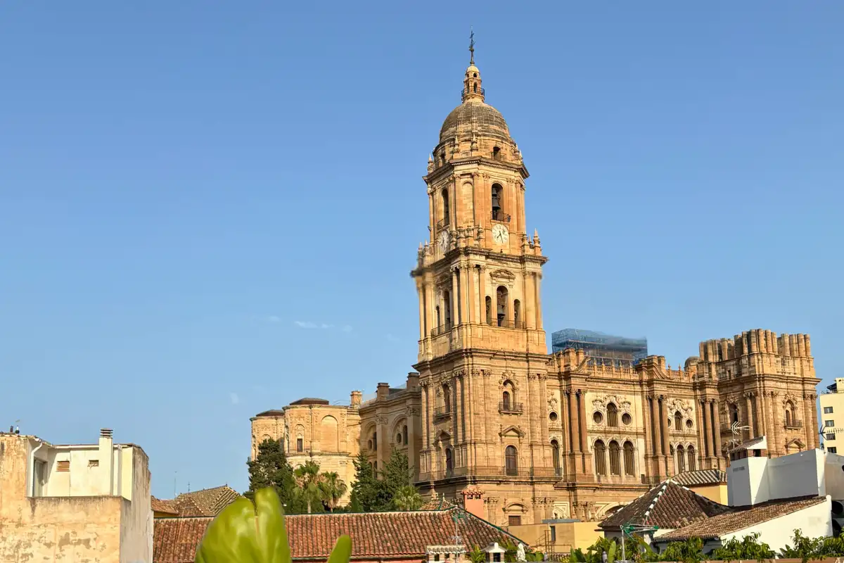 Malaga Cathedral towering above the old town in golden evening light