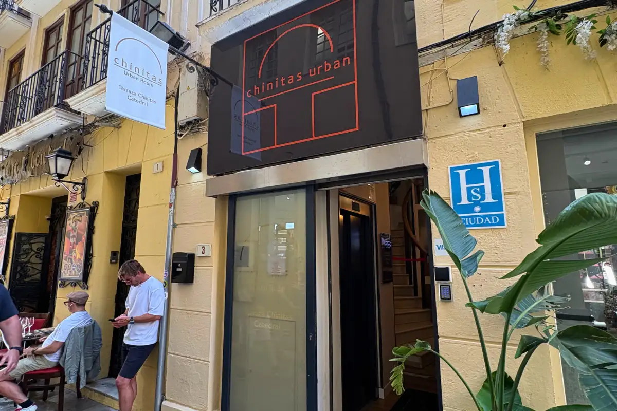 Chinitas Urban hostel entrance on a narrow Malaga old town street