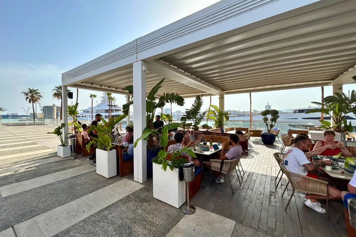 Beachfront dining terrace under retractable awnings at Cobalto 15 Malaga