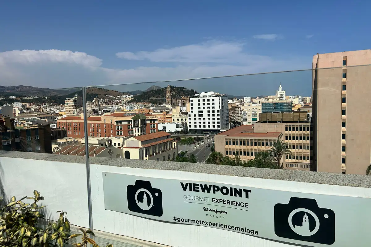 White dining tables and patterned floor on the El Corte Ingles terrace, Malaga