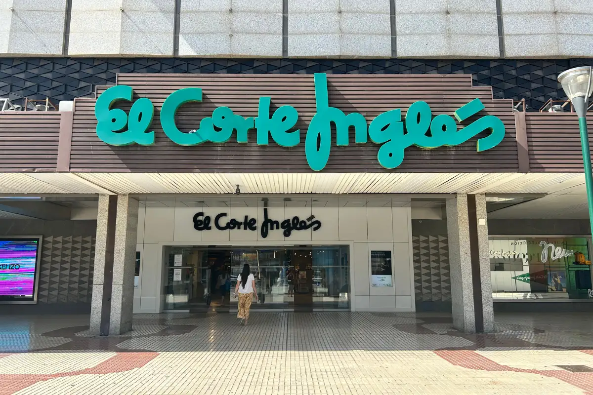 Green El Corte Ingles store sign above the main entrance in Malaga