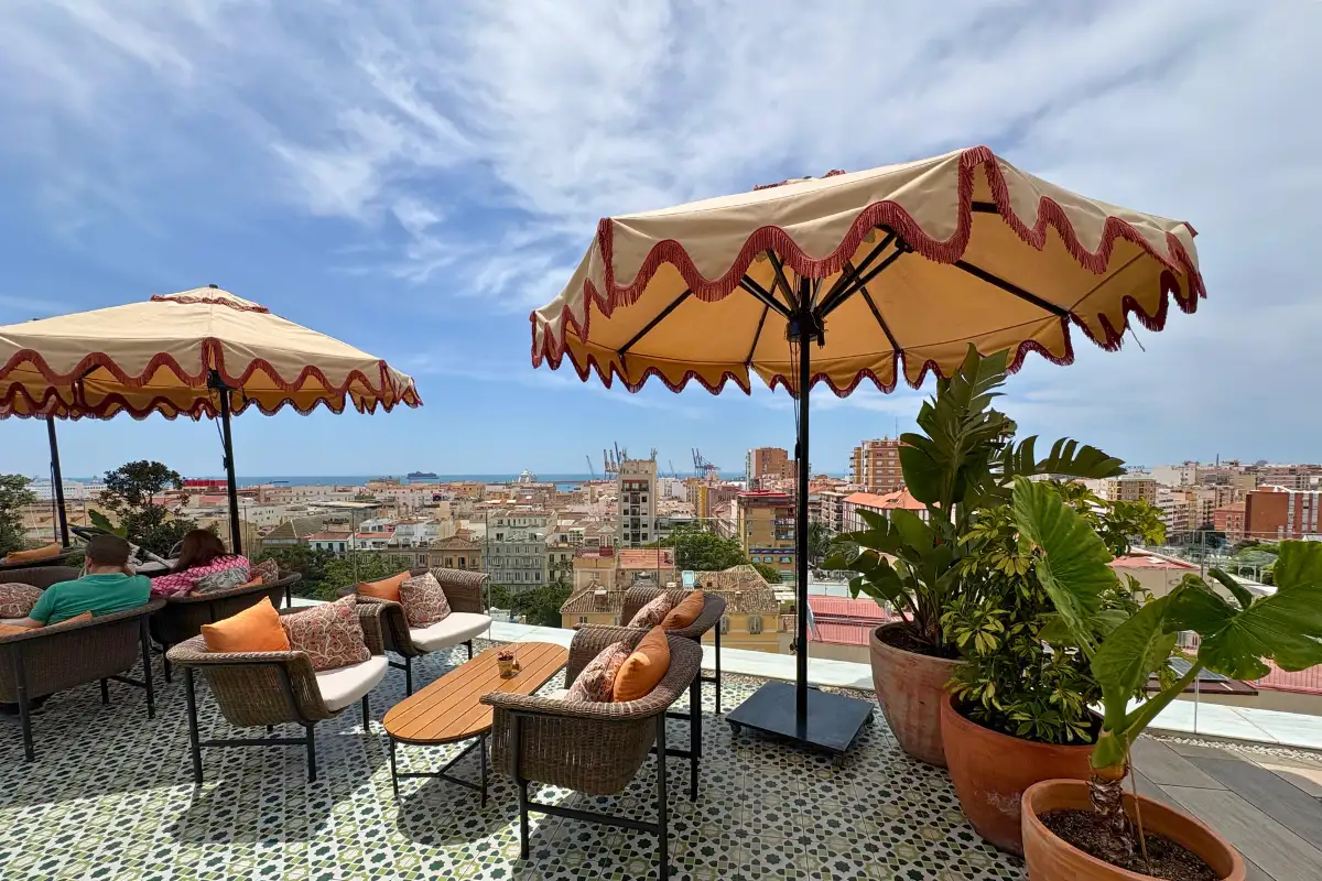 Parasols and lounge seating overlooking the city at H10 Croma, Malaga