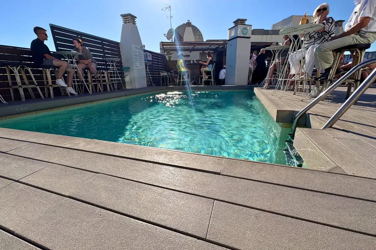 Rooftop plunge pool with the cathedral behind at Molina Lario, Malaga