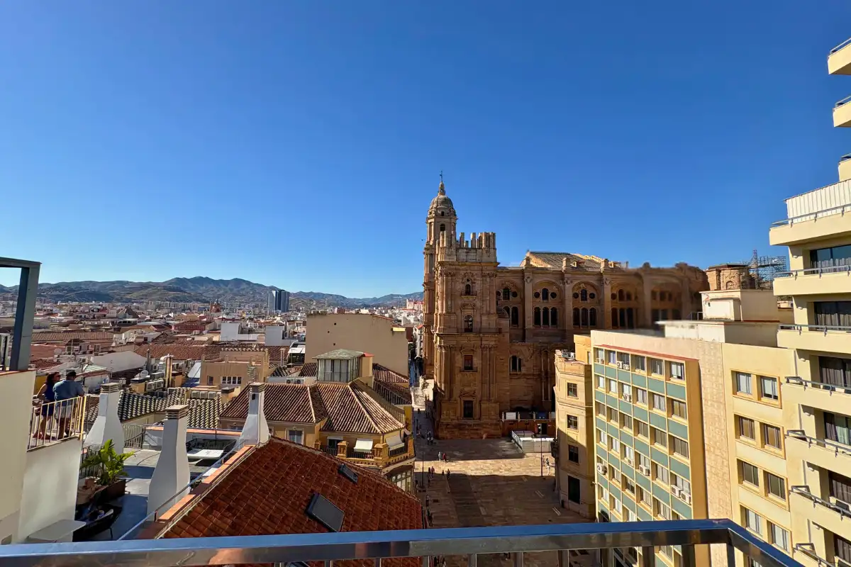 Malaga cathedral and city rooftops from the Molina Lario terrace