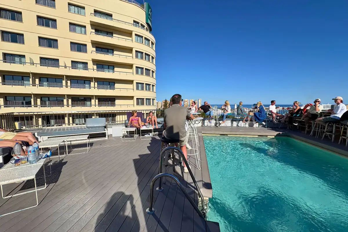 Photographer filming beside the rooftop pool at Molina Lario, Malaga