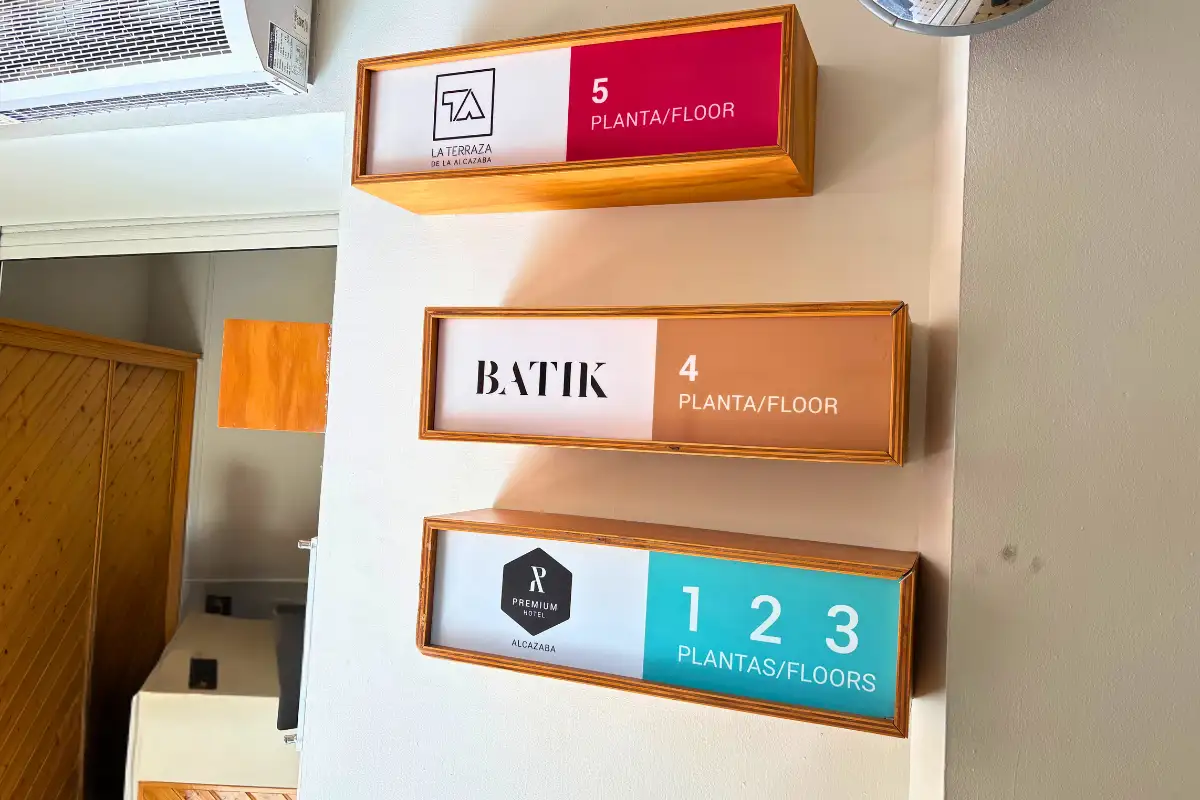Floor directory signs in the building leading to La Terraza de Alcazaba in Malaga
