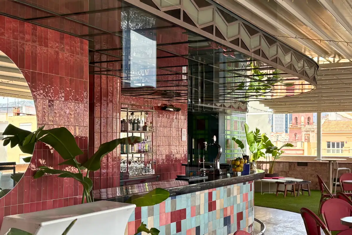 Pink mirrored bar and colourful tiles at La Terraza de Larios in Malaga
