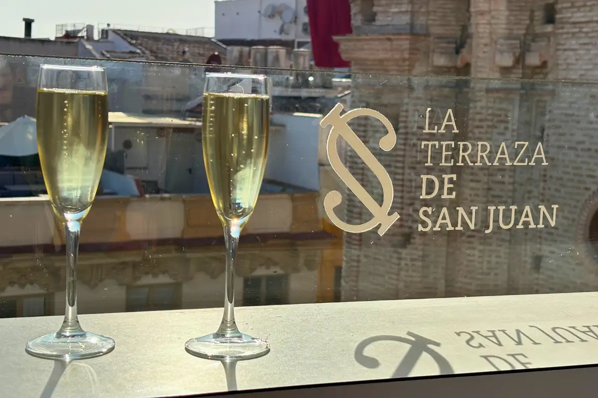 Two cava glasses on the ledge at La Terraza de San Juan rooftop bar in Malaga