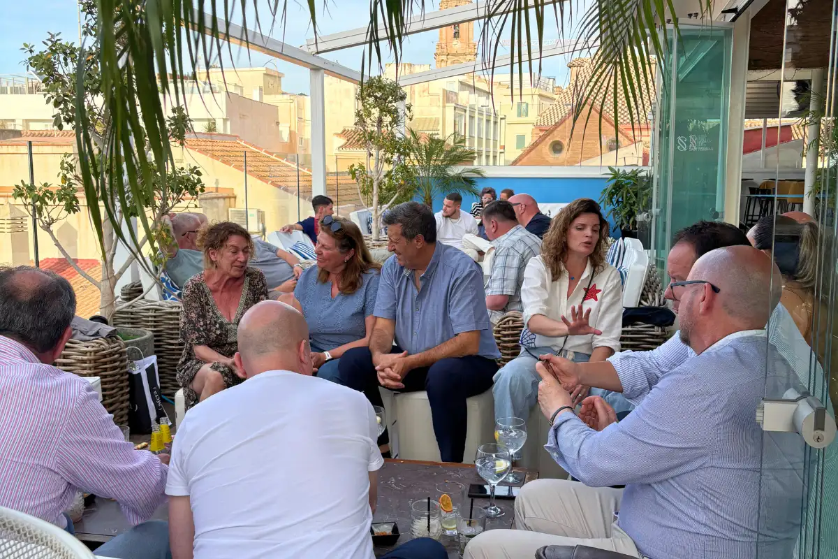 Guests chatting over drinks on the terrace at La Terraza de San Juan in Malaga