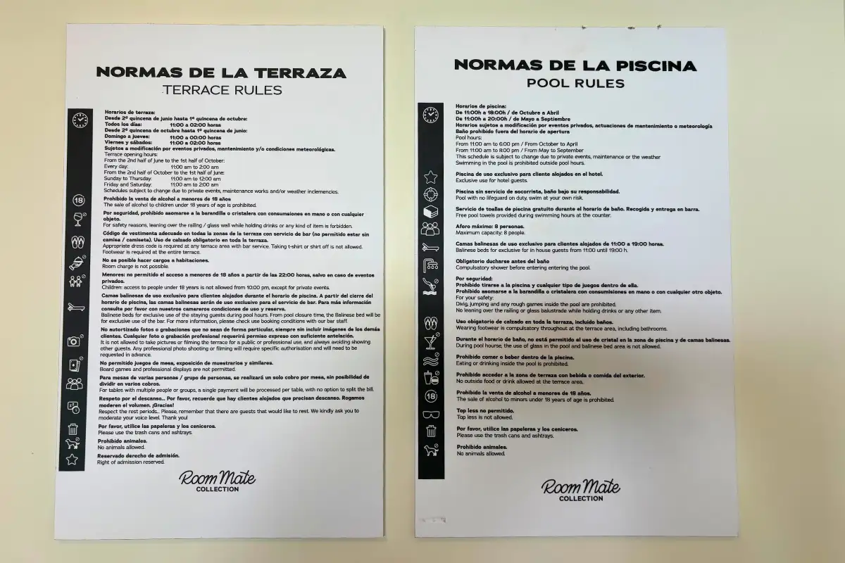 Terrace and pool rules signs in Spanish and English at La Terraza de Valeria in Malaga