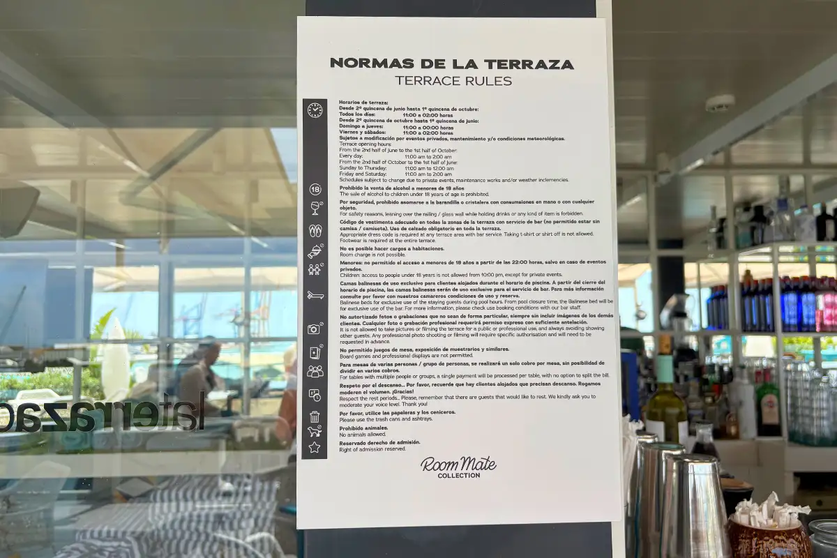 Printed terrace rules sign by the bar at La Terraza de Valeria in Malaga