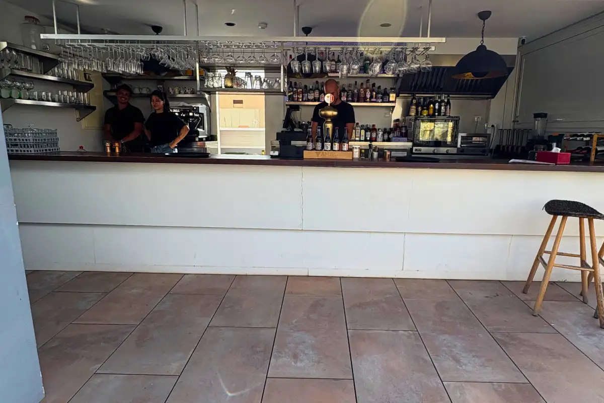 Bartenders working the long bar counter at EFECTO Rooftop, Hotel Mariposa Malaga