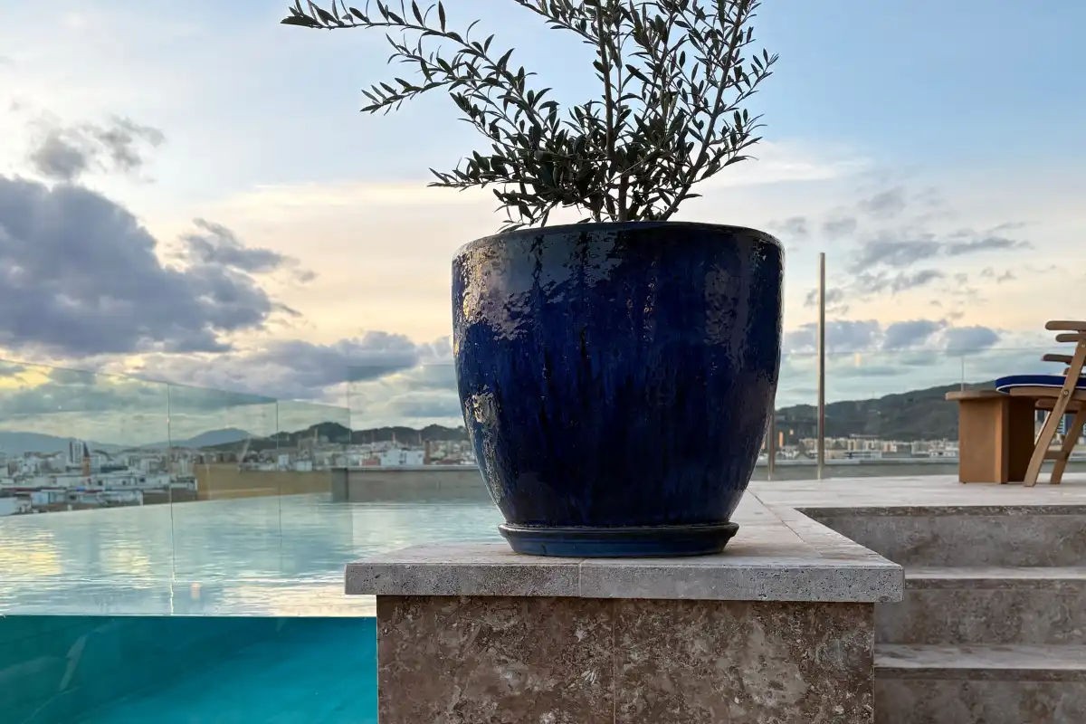 Blue ceramic planter beside the pool with sea views at ME Malaga
