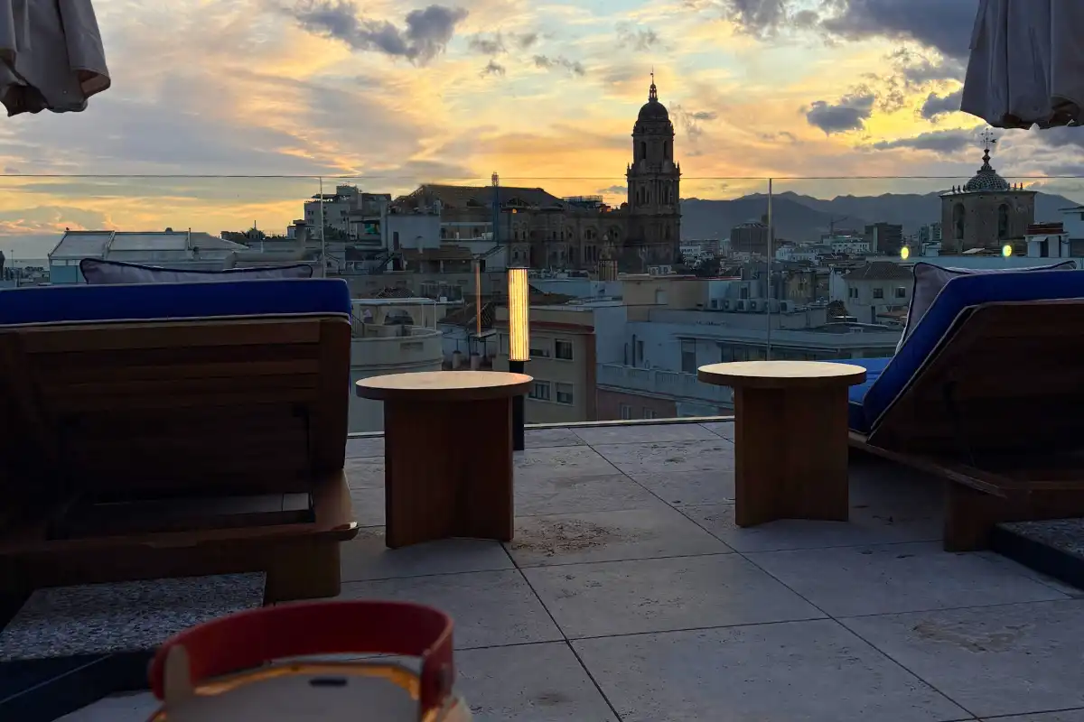 Terrace seating facing the cathedral at sunset at Canitas Maite, ME Malaga