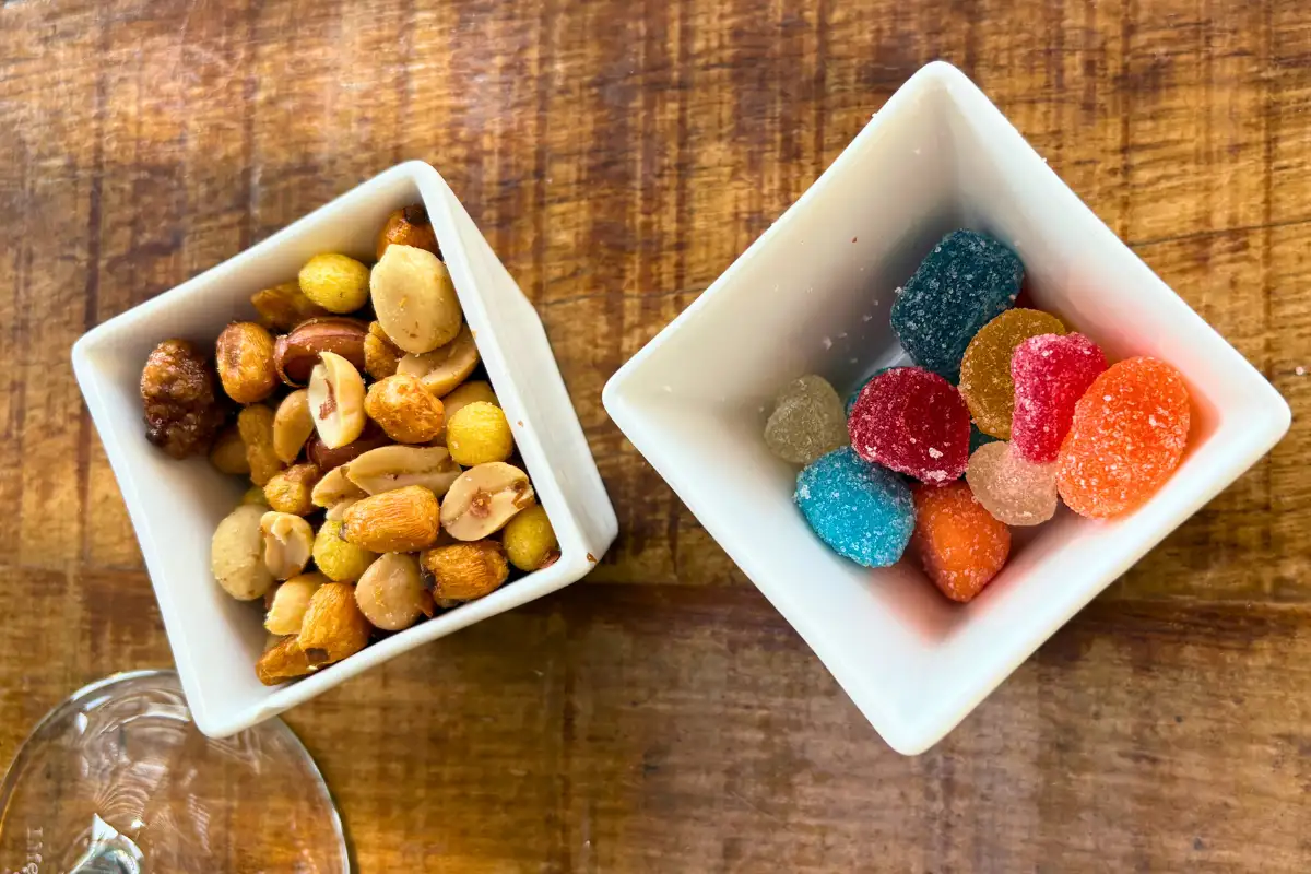 Bowls of mixed nuts and sweets served at Terraza Catedral rooftop bar in Malaga
