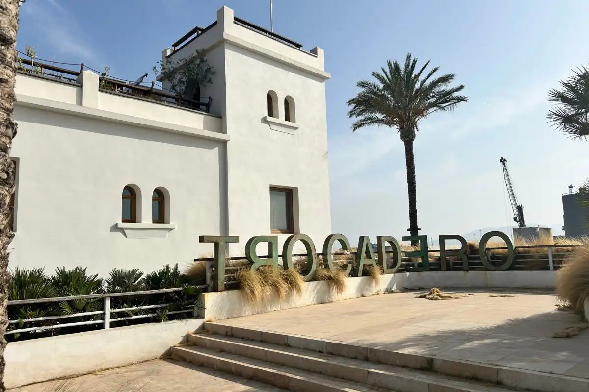 White tower building with Trocadero lettering near the port in Malaga