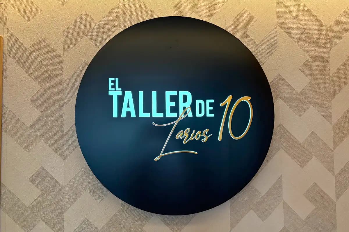 El Taller de Larios 10 logo sign on a textured wall at Vincci Larios Diez in Malaga