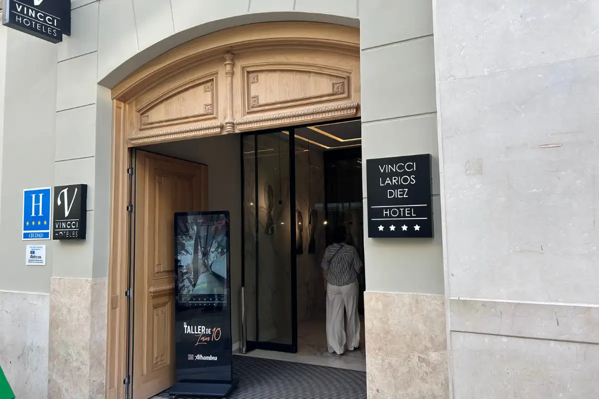 Arched street entrance to Vincci Larios Diez hotel in Malaga