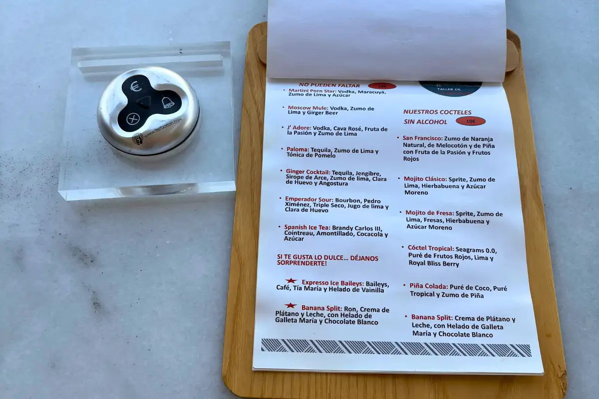 Cocktail and tasting menu on a marble table at Vincci Larios Diez Malaga