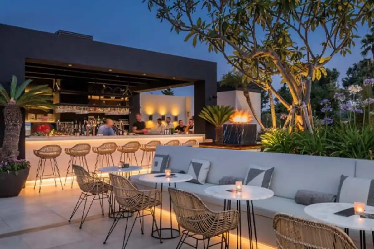 Illuminated bar and lounge seating at night at Air by Breathe Marbella