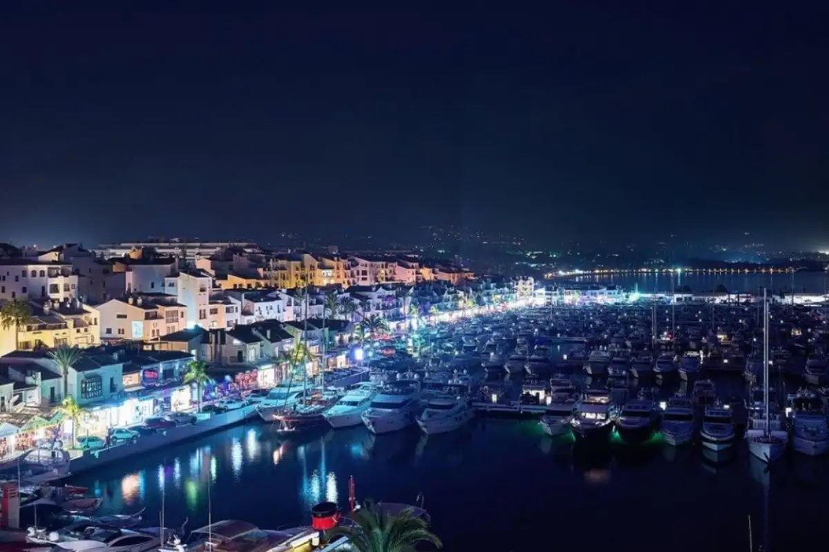 Puerto Banus marina lit up at night from Benabola Sky Lounge Marbella