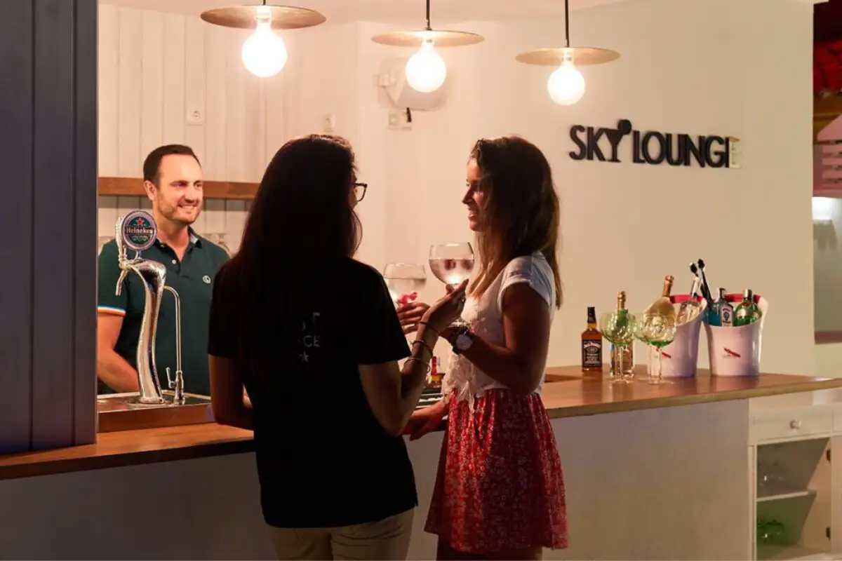 Guests chatting over wine at the Benabola Sky Lounge bar in Marbella