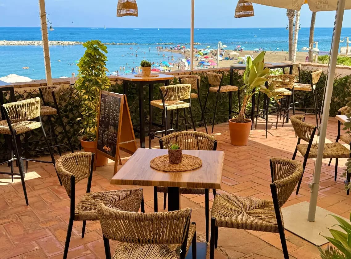 Terracotta dining terrace overlooking the beach and sea at Almika Rooftop, Benalmadena
