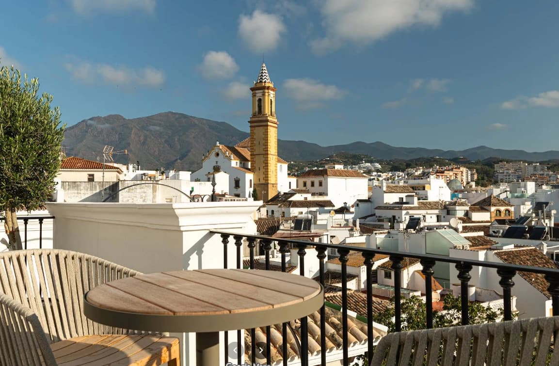 Rooftop table overlooking the church tower and old town at Bermeja Views, Estepona