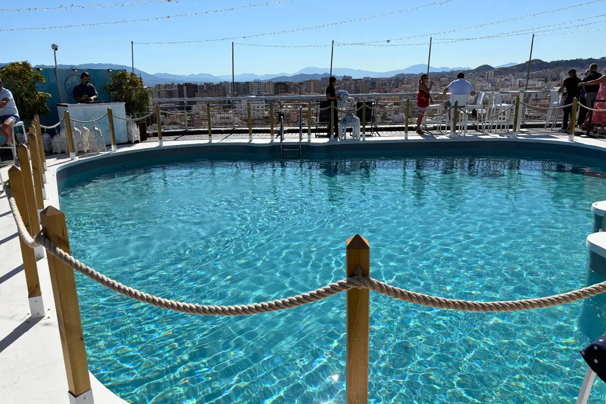 Rope-edged rooftop pool overlooking the Malaga skyline at AC Hotel Malaga Palacio