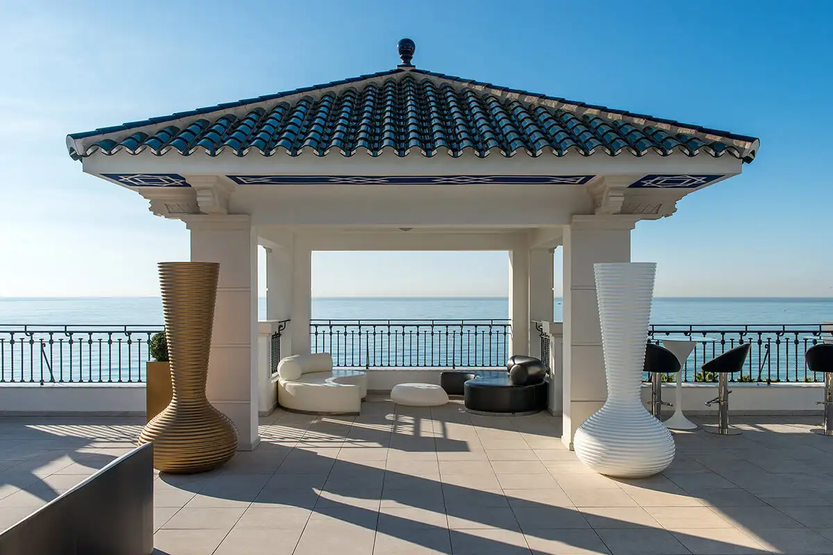 Tiled gazebo and terrace seating overlooking the sea at Media Luna, Gran Hotel Miramar, Malaga