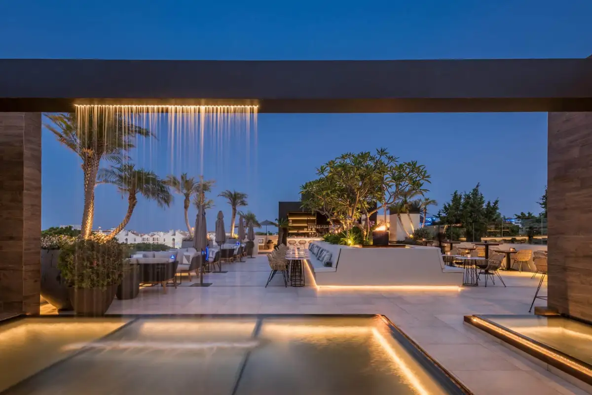 Modern lounge terrace with mood lighting at dusk at Air by Breathe Marbella