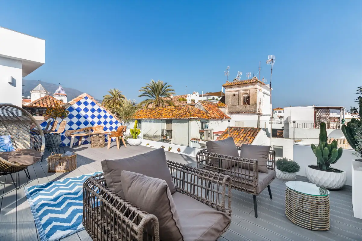 Terrace seating overlooking old town rooftops at La Fonda, Marbella