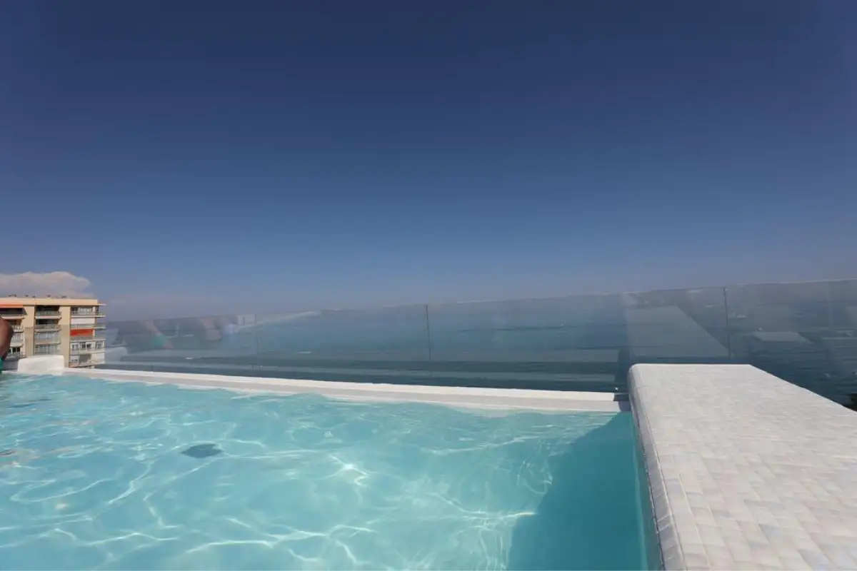 Infinity pool merging with the sea horizon at Hotel Ritual in Torremolinos