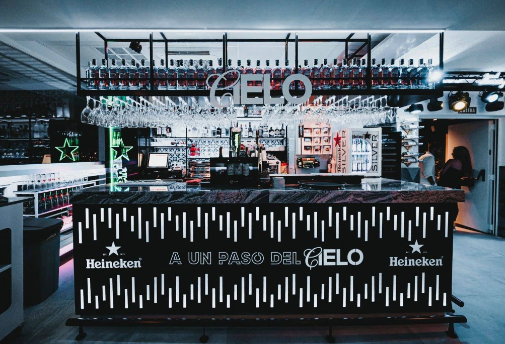 Backlit cocktail bar with Heineken branding at Cielo Skybar, Estepona