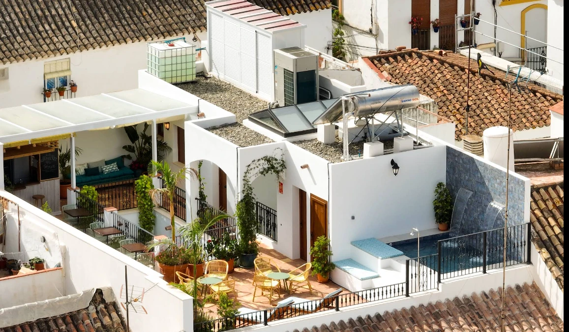 Aerial view of the rooftop plunge pool and terraces at Hostel Veranera, Estepona