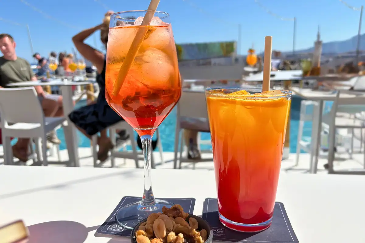 Aperol spritz and a cocktail beside the rooftop pool at AC Hotel Malaga Palacio