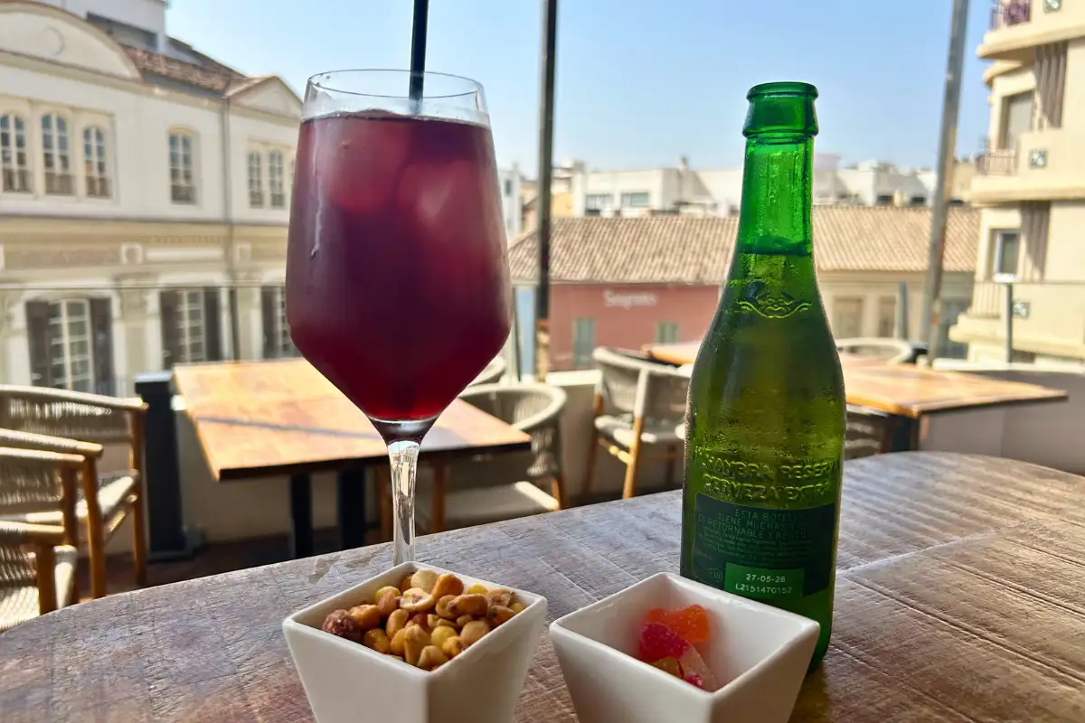 Glass of sangria and snacks with rooftop city views at Terraza Catedral in Malaga
