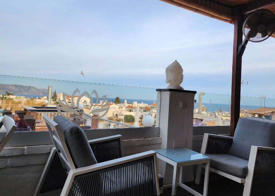 Terrace seating overlooking the town and sea at Buddha Lounge, Nerja