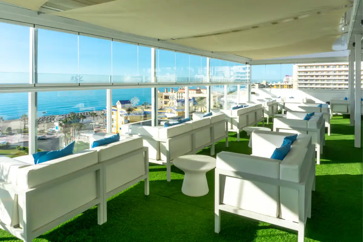White lounge sofas on a grassed rooftop terrace at Los Jazmines Torremolinos